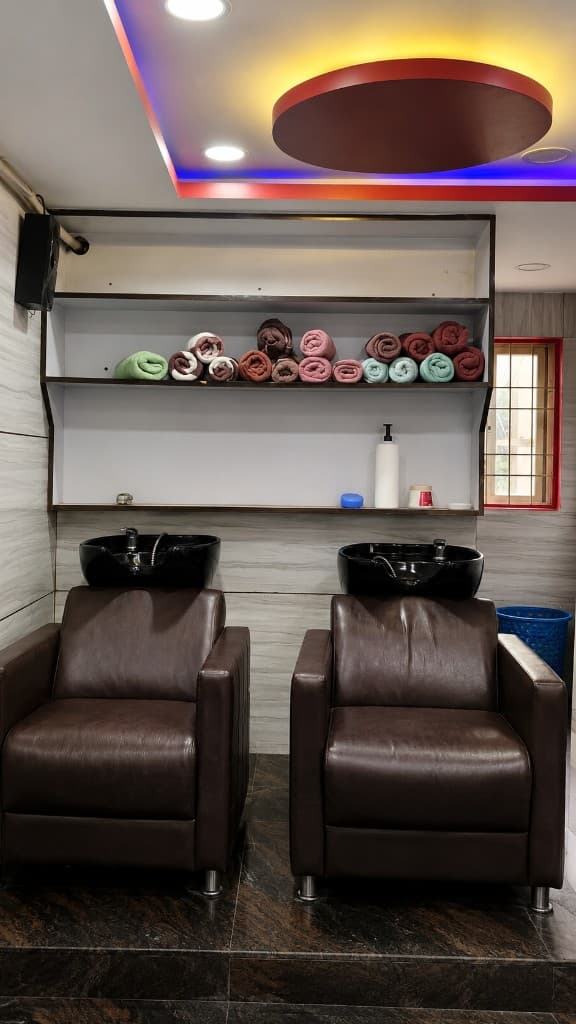 Hair washing stations with towel storage